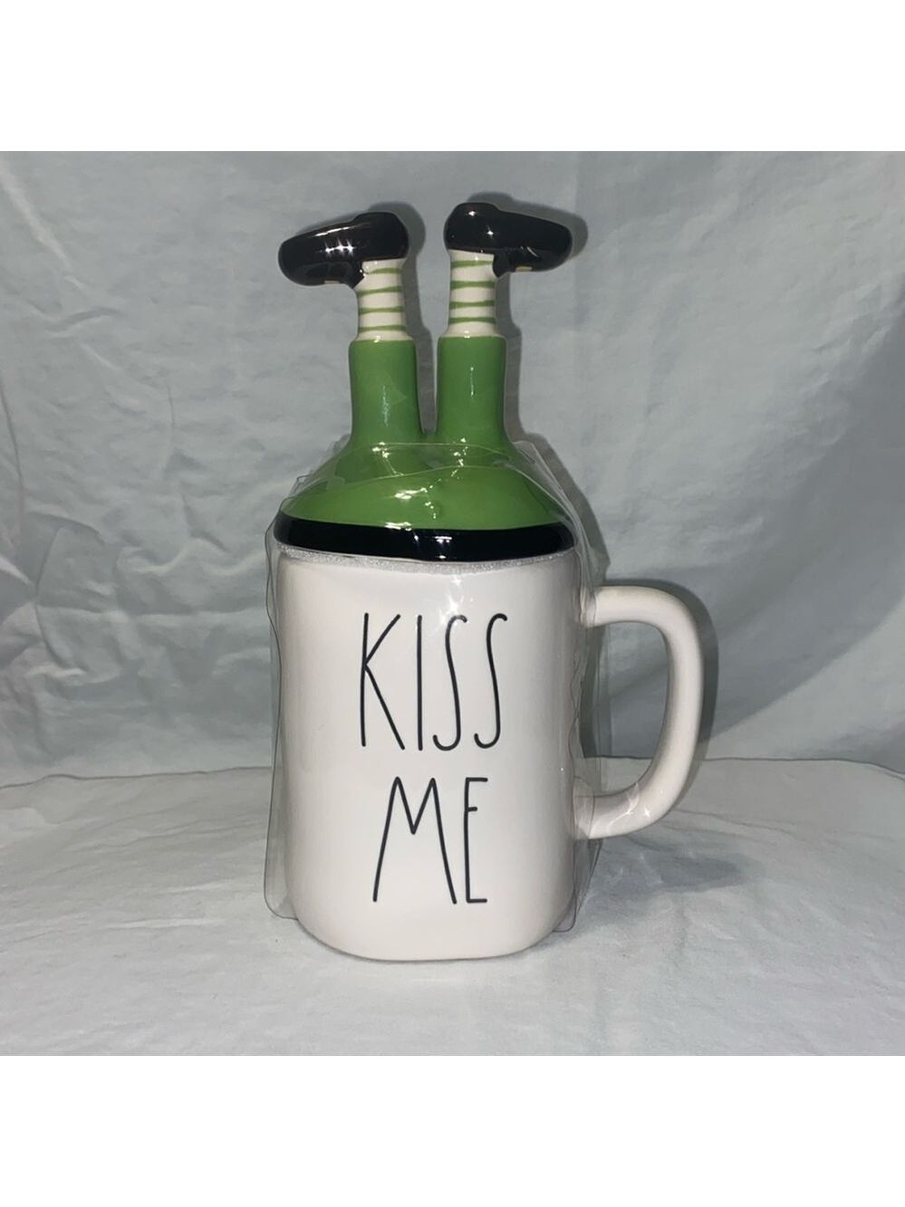 Rae Dunn “Kiss Me” mug withh leprechaun cover, so cute!